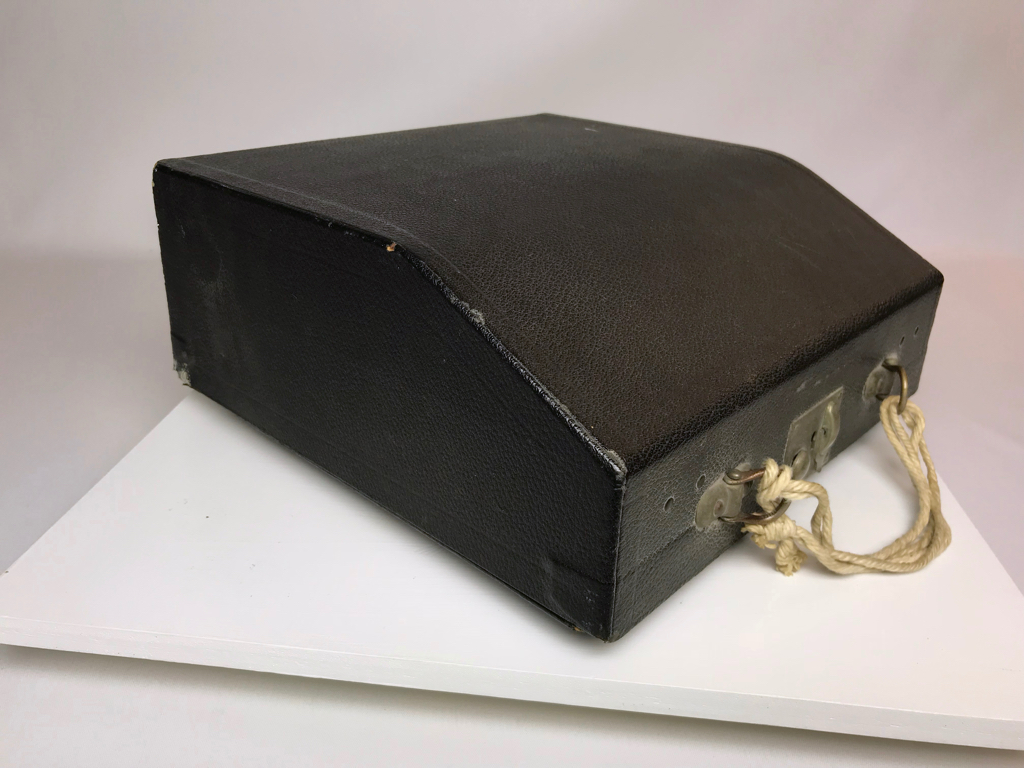 Case handle has been replaced with twine.